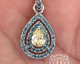 Fancy Light Yellow Pear Shaped Diamond Pendant With Fancy Blue Diamond.