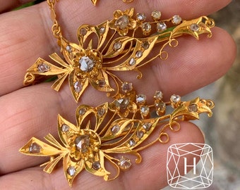 A gorgeous set of three antique gold brooches set with Polki Diamonds with patterned chains.