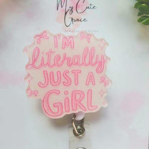 I&#39;m Literally Just A Girl Badge Reel: Coquette Pink Glitter Bow