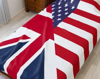 May include: A bedspread featuring a design that combines the flags of the United States and the United Kingdom. The bedspread is primarily white, red, and blue, with the Union Jack on the left and the American flag on the right.