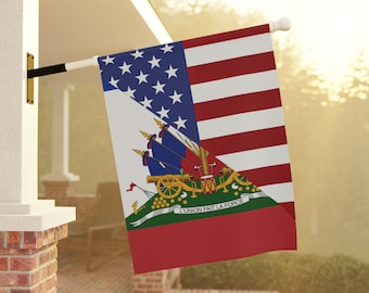 May include: A flag combining the design of the United States flag with the flag of Haiti. The flag is displayed outdoors, mounted on a white pole. The flag features red and white stripes, blue stars, and the Haitian coat of arms.