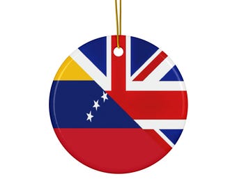 May include: A round, ceramic ornament featuring a flag design. The design combines elements of the Venezuelan flag with the Union Jack. The ornament has a gold string for hanging. The colors include red, blue, yellow, and white.