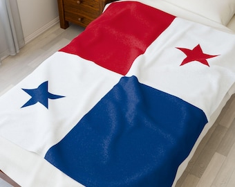 May include: A white blanket with the flag of Panama design. The blanket features a red square in the upper left corner and a blue square in the lower right corner. Two red stars and two blue stars are also visible.