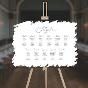 Puede incluir: Un diagrama de asientos de acrílico blanco con texto negro. El diagrama está titulado "Sitzplan" y enumera las mesas del 1 al 11 con los nombres de los invitados asignados a cada mesa.