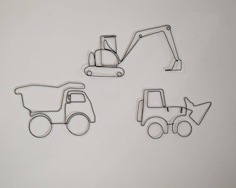 May include: Three black wire construction vehicles: a dump truck, a front-end loader, and an excavator. The minimalist designs are mounted on a white wall, creating a modern, industrial aesthetic. Perfect for a child's room or a construction-themed space.