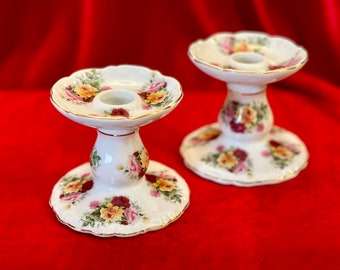 Porcelain candle holders with hand painted flowers, Pair of Leonardo collection rose decorated holders