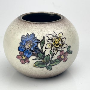 Hand decorated small vase with blue and white flowers