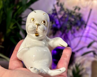 Small white seal, seal figurine with gold decor