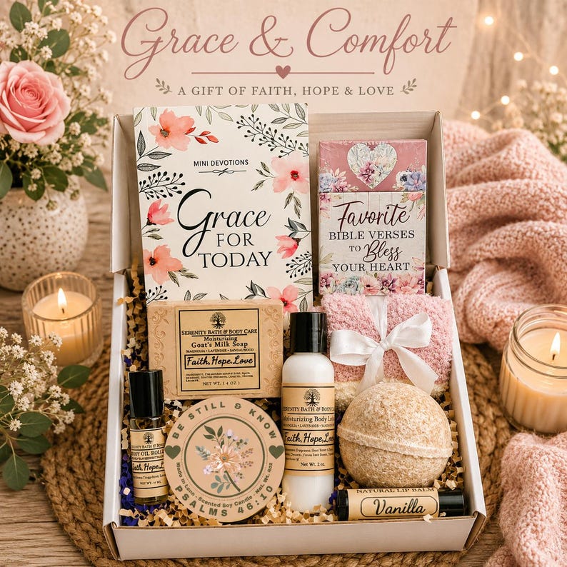 May include: A gift box containing a Grace for Today devotional book, a Favorite Bible Verses card, a bar of goat's milk soap, a bottle of body lotion, a body oil roller, a scented soy candle, a bath bomb, a vanilla lip balm, and fuzzy socks.