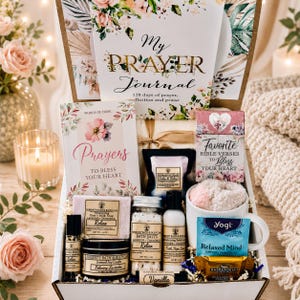 May include: A gift box containing a My Prayer Journal, a Prayers to Bless Your Heart book, a Favorite Bible Verses box, a mug with a fuzzy sock, a Relax goat's milk soap, bath salts, body lotion, a candle, a vanilla lip balm, and tea.