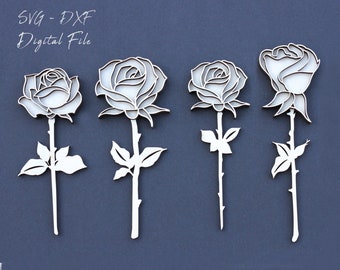 May include: Five white rose flower cutouts, each with a stem and leaves, are arranged in a row against a dark blue background. The text "SVG - DXF Digital File" is at the top of the image.