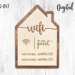 May include: A wooden sign shaped like a house with the word "wifi" and the text "be our guest" in a cursive font. The sign also includes the network name "smiths123" and the password "smiths123".