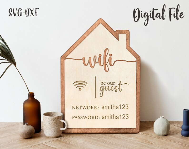 May include: A wooden sign shaped like a house with the word "wifi" and the text "be our guest" in a cursive font. The sign also includes the network name "smiths123" and the password "smiths123".