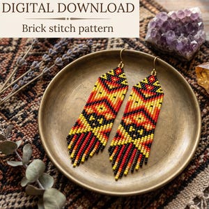 May include: A pair of long, dangling beaded earrings featuring a geometric pattern in black, red, orange, and yellow seed beads. The earrings have a brick stitch design with a fringed bottom edge and gold-toned metal hooks. Text reads DIGITAL DOWNLOAD Brick stitch pattern.