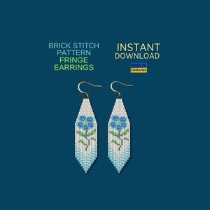 May include: A pair of white beaded fringe earrings with a blue flower design. The earrings are made with brick stitch and are available for instant download. The text "INSTANT DOWNLOAD" and "MADE IN UKRAINE" is also visible in the image.