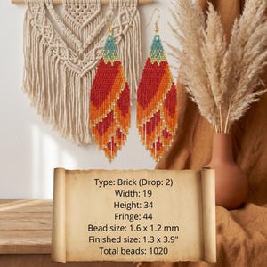 May include: A pair of long, leaf-shaped beaded earrings featuring a gradient of teal, orange, red, and yellow glass beads with a fringe bottom. Text on the image lists: Type: Brick (Drop: 2), Width: 19, Height: 34, Fringe: 44, Bead size: 1.6 x 1.2 mm, Finished size: 1.3 x 3.9", Total beads: 1020.