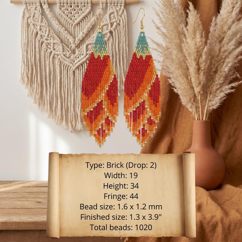 May include: A pair of long, leaf-shaped beaded earrings featuring a gradient of teal, orange, red, and yellow glass beads with a fringe bottom. Text on the image lists: Type: Brick (Drop: 2), Width: 19, Height: 34, Fringe: 44, Bead size: 1.6 x 1.2 mm, Finished size: 1.3 x 3.9", Total beads: 1020.