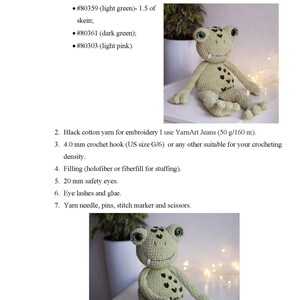 May include: Crochet pattern instructions for making a green frog amigurumi toy. The pattern includes a list of materials and tools needed to complete the project. The image shows a completed green frog amigurumi toy with safety eyes and a toothy grin.