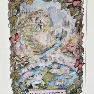 May include: A watercolour illustration titled RIBBETDELL featuring three frogs on lily pads in a pond, surrounded by a frame of ivy vines and pink butterflies. The scene includes a stone building on a cliff, a waterfall, and a stone bridge.