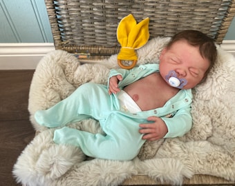 Custom painted full body silicone baby Indigo  closed eyes in super soft platinum silicone blend