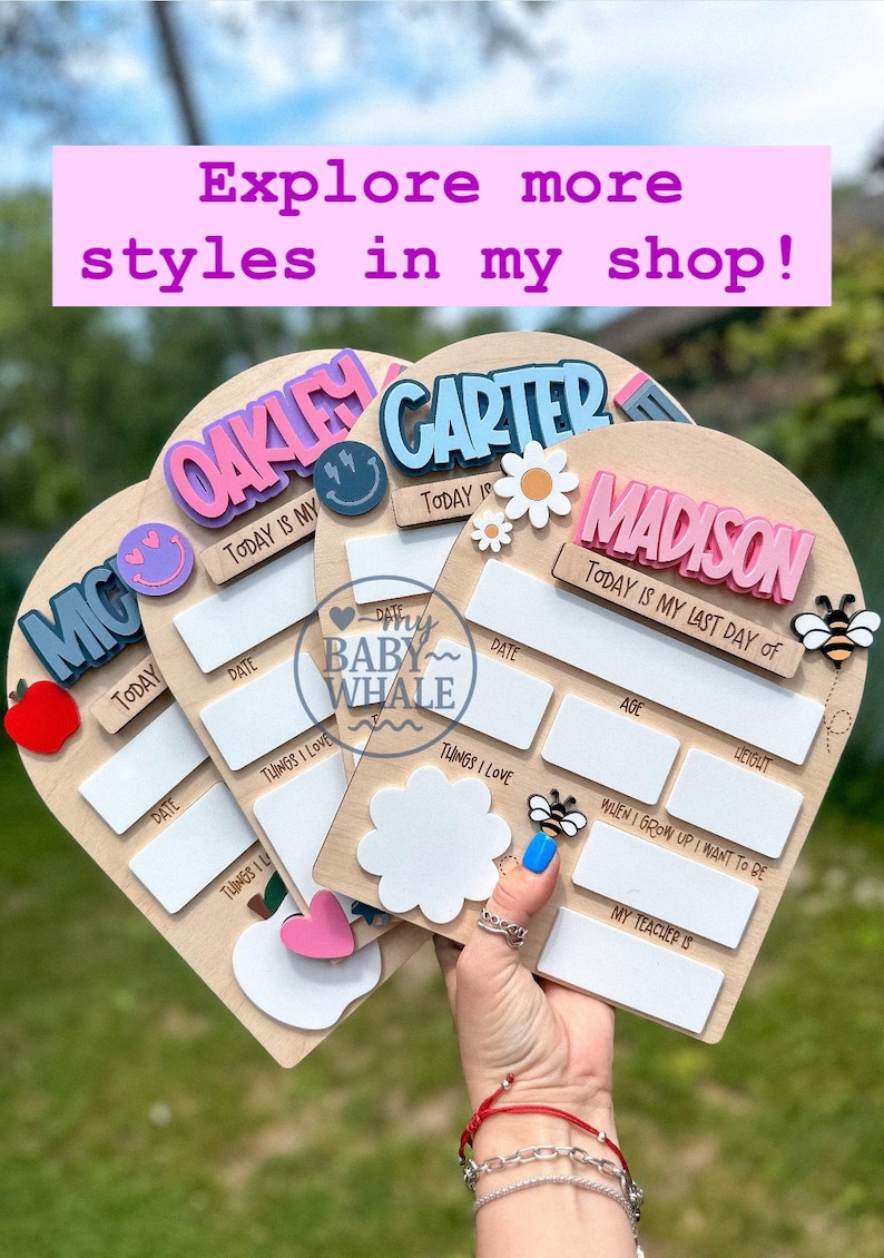 May include: Wooden milestone boards with names like Oakley, Carter, and Madison. Each board has spaces for dates, things loved, age, and weight, with decorative elements such as a bee, flower, and smiley face. The boards are heart-shaped.