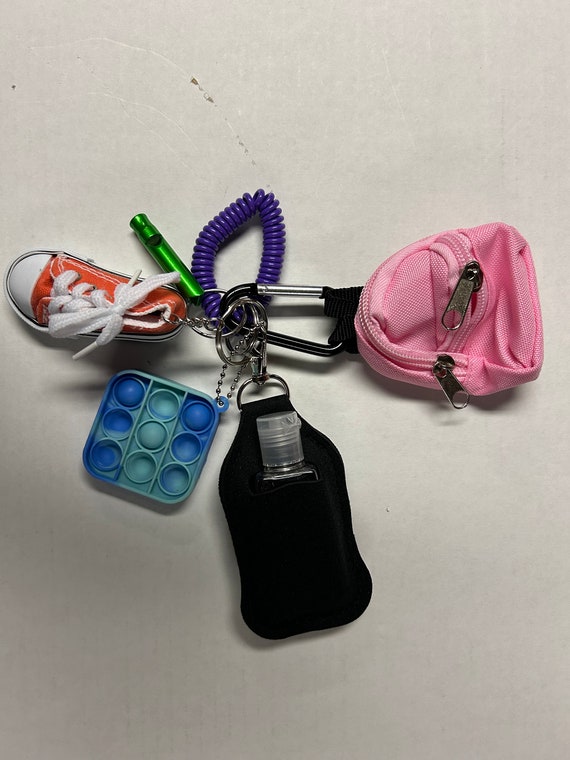 Backpack Buddy - Kids Backpack Safety Keychain - Emergency Whistle, Hand Sanitizer, Pop Fidget, Wristlet, Shoe Keychain, Backpack Keychain A