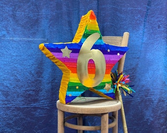 Number six piñata, add cheer to your anniversary or sixth birthday party with an oversized gold #6 on a bright rainbow coloured star