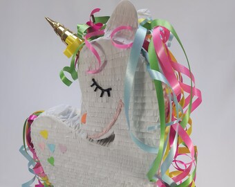 Unicorn Piñata, this fun birthday party game that will compliment your Unicorn Party décor perfectly and make a great gift for unicorn fans
