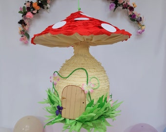 Piñata champignon vénéneux, notre champignon magique agrémentera vos décorations de fête de fées et est un excellent jeu de société pour votre fête d'anniversaire de fée