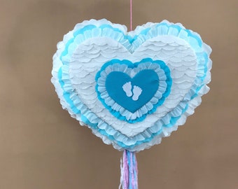 Baby shower piñata, a pretty heart  with pink & blue, cute baby feet details, is the ideal party game for gender reveals and stork parties