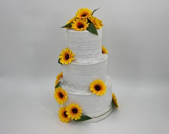 Wedding cake piñata, decorated in bold sunflowers flowers, an ideal party game to add fun & laughter to your wedding reception entertainment