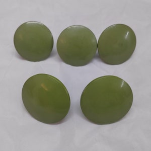 May include: Five round, green, plastic knobs.