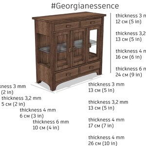 May include: A wooden cabinet with glass doors and drawers. The cabinet is 66 cm wide, 43 cm tall, and 33 cm deep. It has a dark brown finish and features a simple, elegant design.