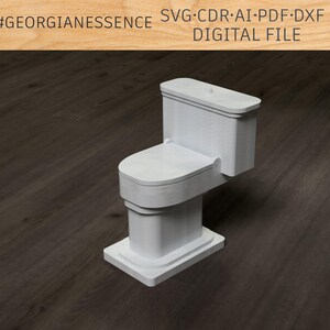 May include: White ceramic toilet figurine. The toilet is in a closed position with the lid down. The toilet is on a wood floor.