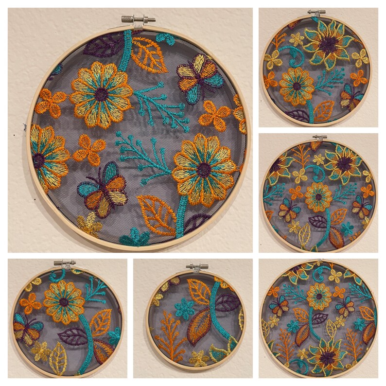 May include: Six embroidery hoops with floral designs on a gray background. The designs feature butterflies, leaves, and flowers in shades of orange, yellow, teal, and purple.