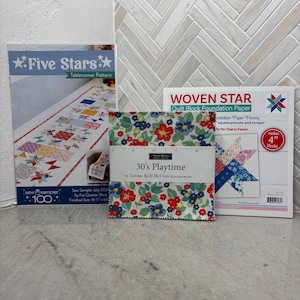 May include: A set of three quilting supplies, including a "Five Stars" tablerunner pattern, a "30's Playtime" fabric fat quarter, and a "Woven Star" quilt block foundation paper. The paper is for making 4-inch blocks.