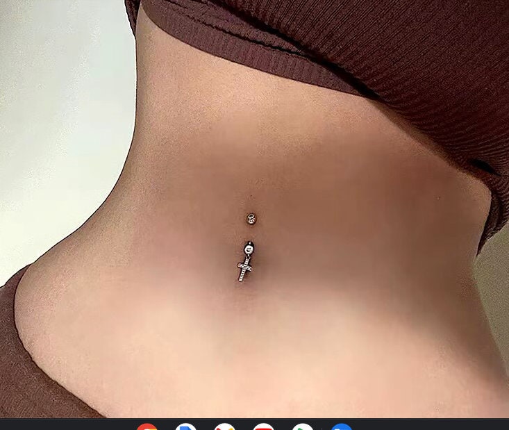 Cross belly piercing deals