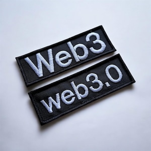 May include: Two black rectangular patches with white embroidered text. One patch reads "Web3" and the other reads "Web3.0". The patches are likely for clothing or accessories, and are set against a white background.