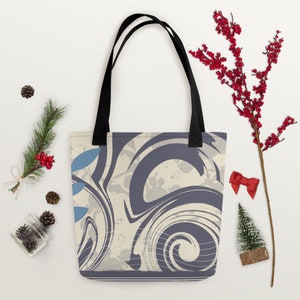 May include: A tote bag with black handles and a cream and purple swirl pattern. The pattern includes blue accents and white lines.