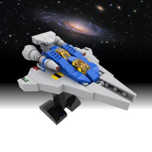 May include: A model spaceship with a gray body, blue cockpit, and yellow accents. The spaceship has two gray engines and is mounted on a black stand. The background features a galaxy with stars.