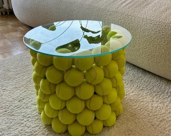 Handmade upcycled side table made from recycled tennis balls with a round glass top | Sustainable design | Modern home accessory