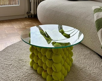 Handcrafted triangular upcycled side table made from recycled tennis balls with a round glass top | Sustainable design