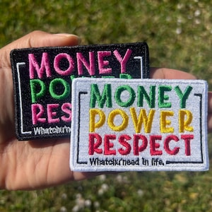 May include: Two embroidered patches with the text "Money Power Respect" in different colors. The top patch is black with pink, green, and white text. The bottom patch is white with green, yellow, and red text. Both patches have a black border.