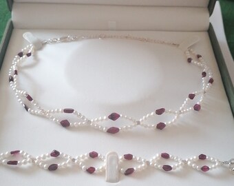 Hand cut, Garnet gemstone and white, genuine freshwater pearl, necklace and braclet set, sterling silver lobster claw clasp closure.