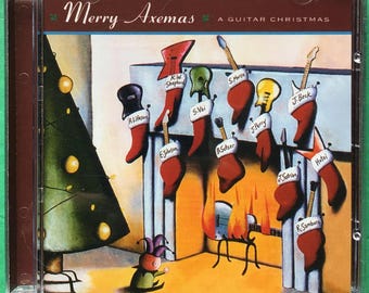 May include: A Christmas-themed CD cover with a red background and a title that reads "Merry Axemas A Guitar Christmas". The cover features a cartoon illustration of a fireplace with stockings hung on it. Each stocking has a guitar and a name tag with the name of a famous guitarist.