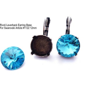 May include: Silver leverback earring base for a 12mm round crystal. The base is shown with a turquoise blue crystal.