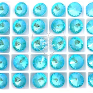 May include: A grid of round, light blue crystal rhinestones. Each gem has multiple facets, reflecting light. The image includes the text "Bijouterie Jewelry Supplies". These are ideal for jewellery making.