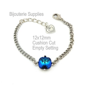 May include: A silver chain bracelet with a heart charm and a 12x12mm cushion cut empty setting.  The setting is ready to be filled with a gemstone.