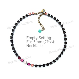 May include: A necklace setting with empty square settings for 6mm stones. The necklace has a dark metal chain with a few pink and white stones. The text "Empty Setting For 6mm (29ss) Necklace" is visible.