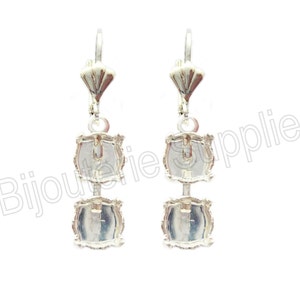 May include: Silver earring findings with two square settings for cabochons. The findings have a lever back closure.